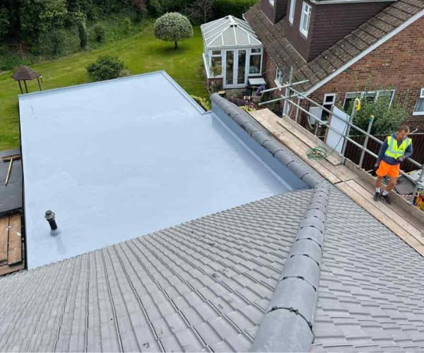 This is a photo of a newly installed hip roof, with a combined liquid covered flat roof. Work carried out by PER Roofing Godmanchester