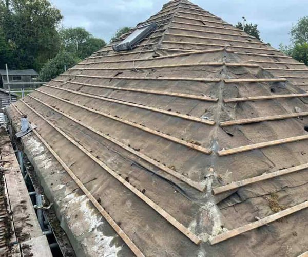 This is a photo of a hip roof that has been stripped back to the battens, and is awaiting a new roof covering to be installed. Works carried out by PER Roofing Godmanchester