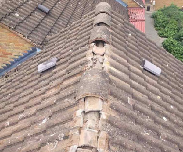 This is a photo if a roof ridge which has missing tiles. The ridge tiles are being replaced by PER Roofing Godmanchester